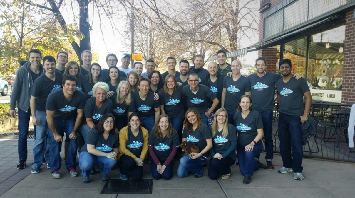 The Bluetree team together outdoors in matching shirts