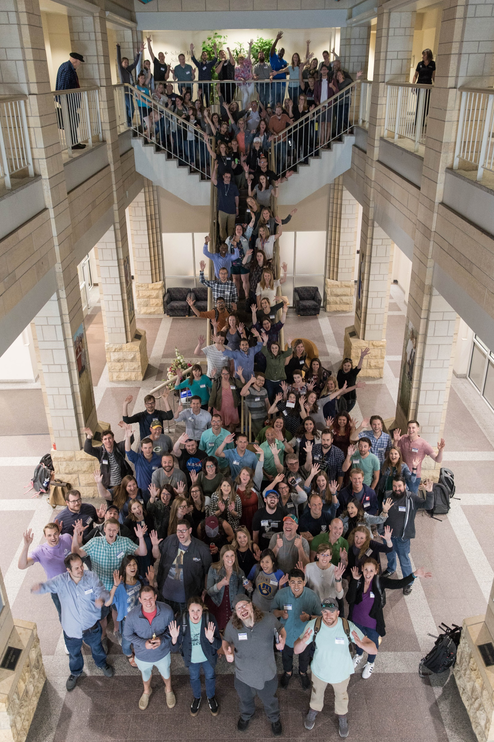 Company teammates gathered on a staircase